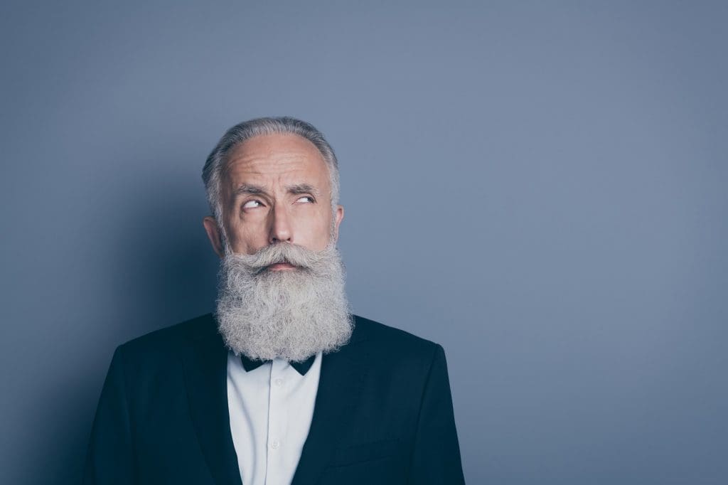 man with a long beard and a suit