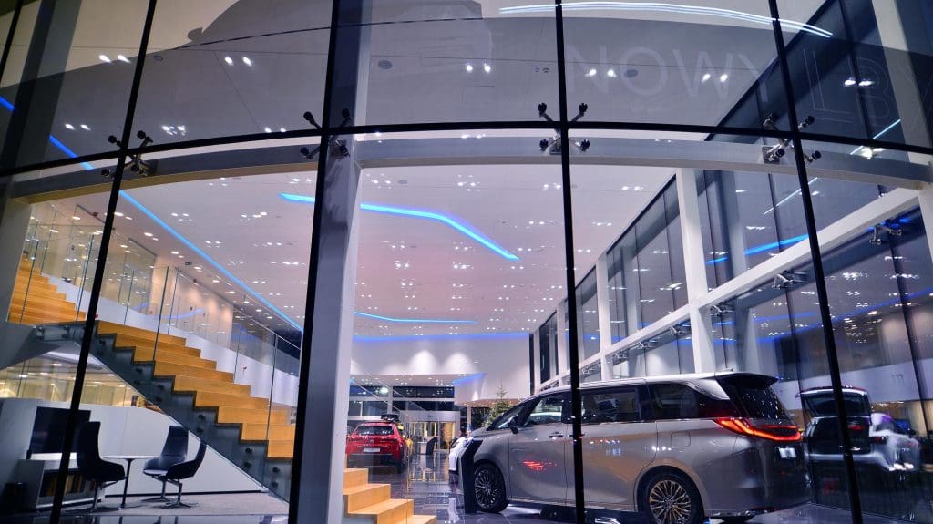 car is parked in front of a building, reflecting the surge in UK EV sales and subsidies