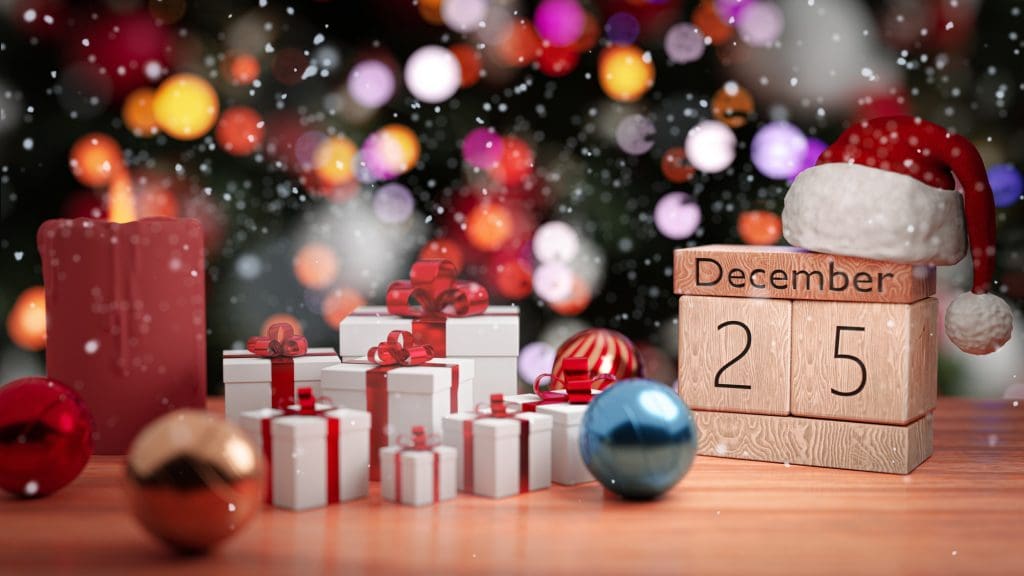 wooden block calendar with a Santa hat on top of it