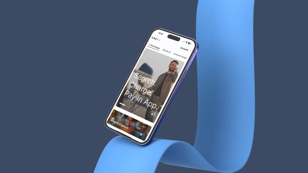 cell phone sitting on top of a blue pipe, representing an EV lifestyle app in the UK