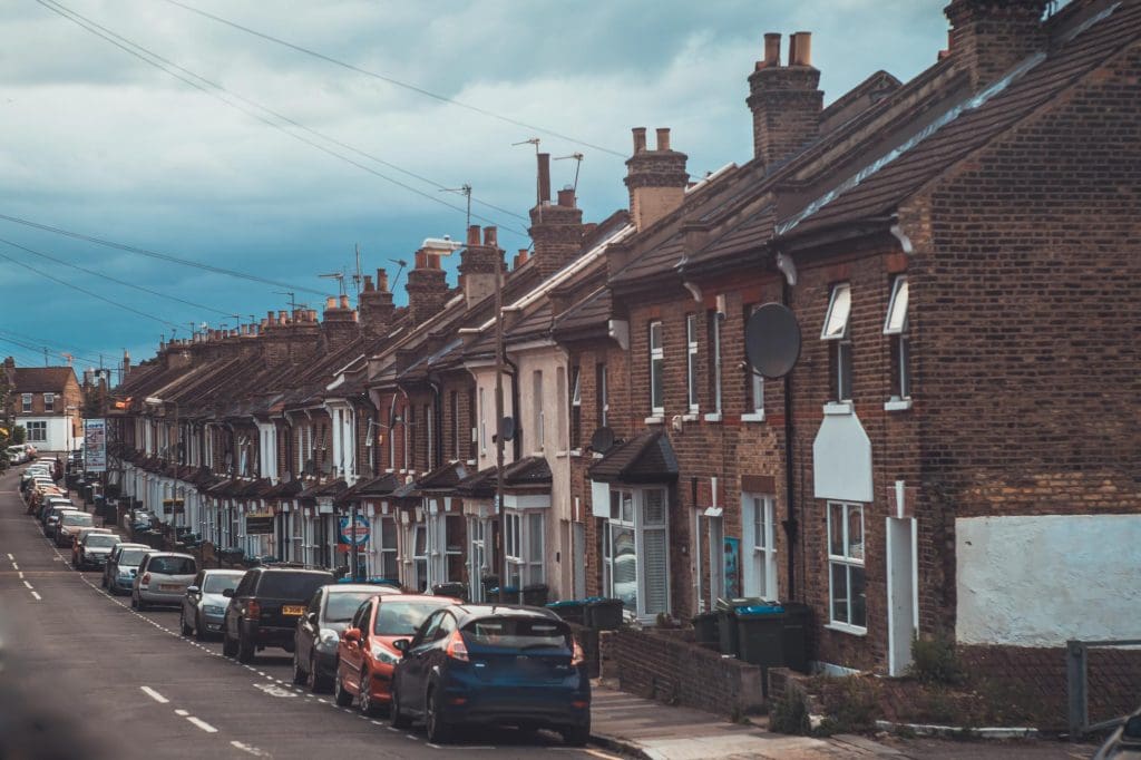 Electric car charging at a kerbside charge point on a UK residential street