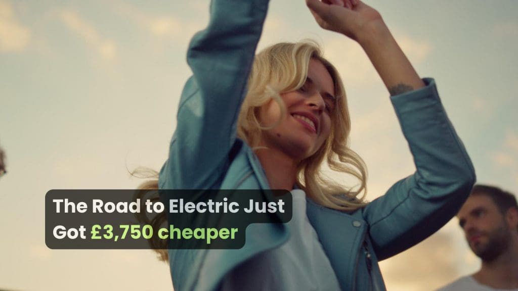 woman raising her arms in the air, celebrating the EV discount UK