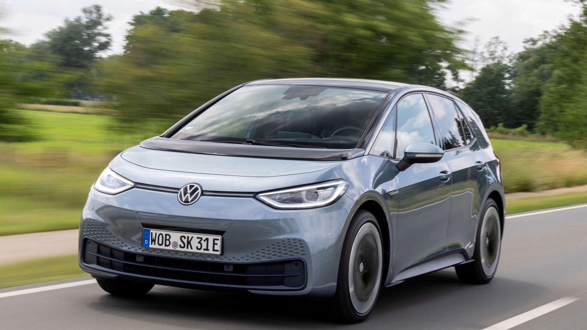 Volkswagen ID.3 driving through a UK city – grey electric hatchback