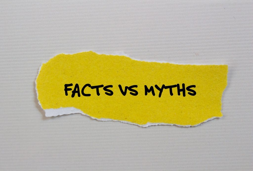 torn piece of paper with the words fact's vs's written on it, addressing ev charging myths in the UK